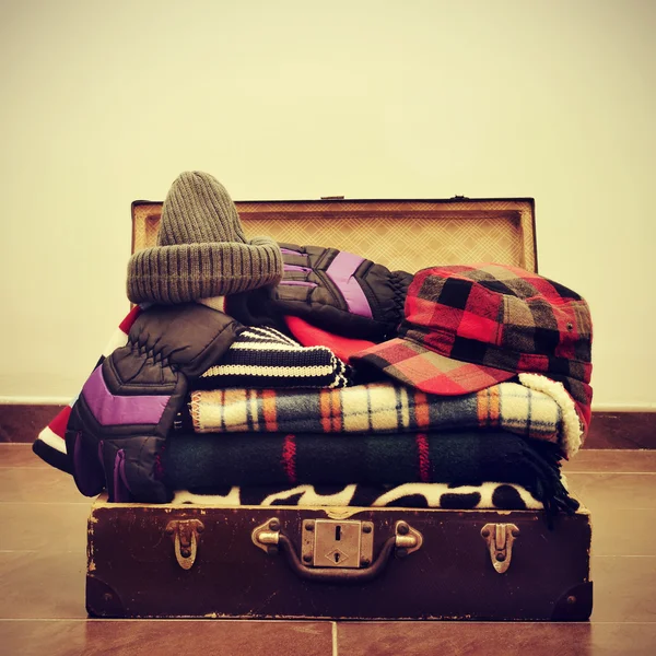 Warming clothes in a suitcase — Stock Photo, Image