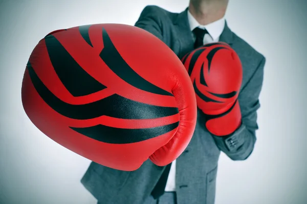 man in suit with boxing gloves