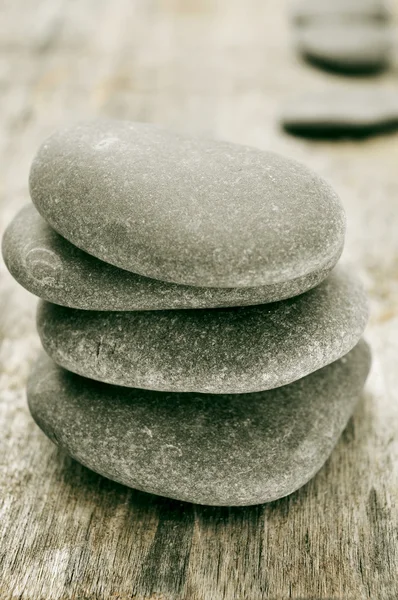 Stones on an old wooden surface — Stock Photo, Image