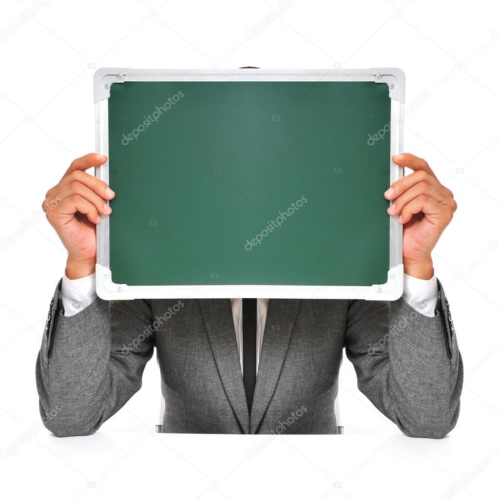 man in suit with a blank chalkboard
