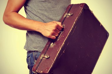 young man with old suitcase clipart