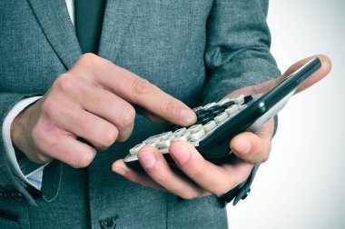 businessman using a calculator clipart