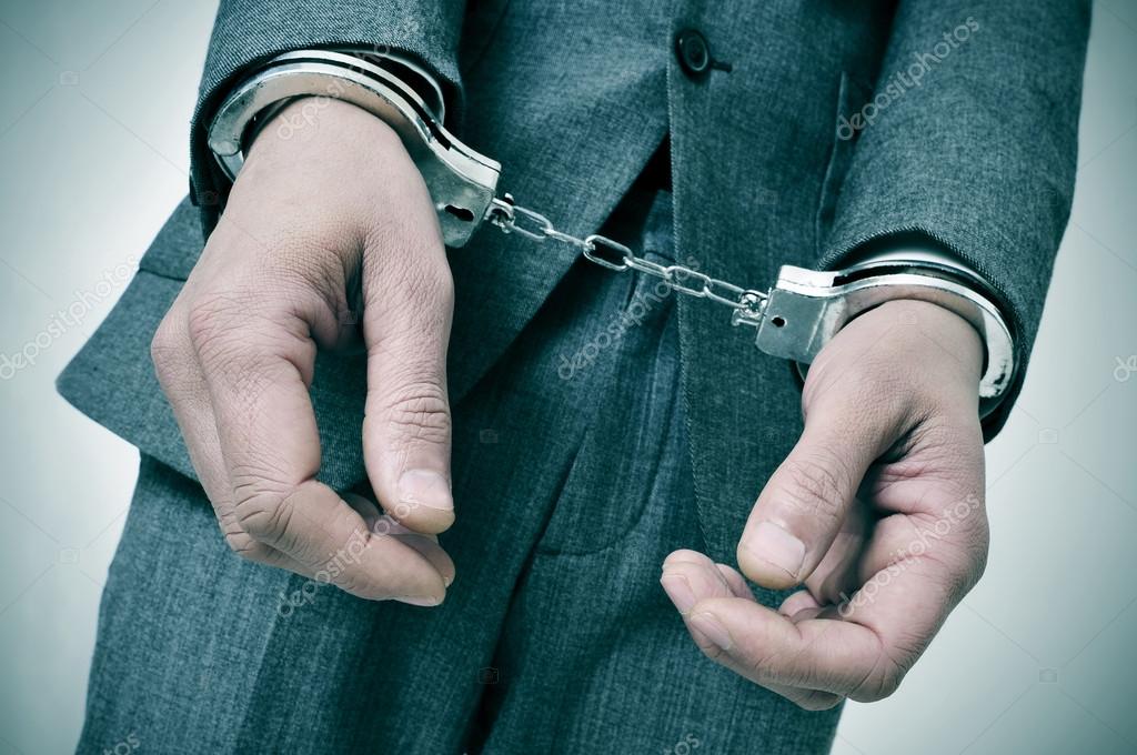 Handcuffed man Stock Photo by ©nito103 40230307