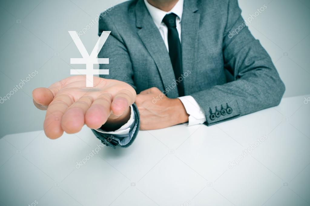 businessman and chinese yuan or japanese yen sign