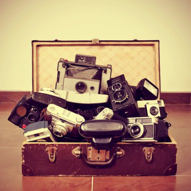 old cameras in an old suitcase clipart