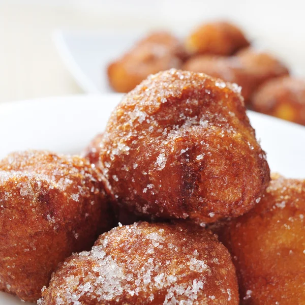 Bunyols de Quaresma, typical pastries of Catalonia, Spain, eaten — Stock Photo, Image