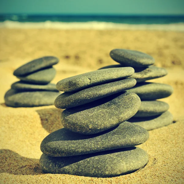 Stones on the beach, with a retro effect — Stock Photo, Image