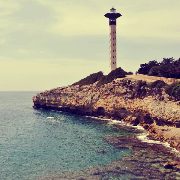 Faro en Torredembarra, España, con un efecto retro —  Fotos de Stock