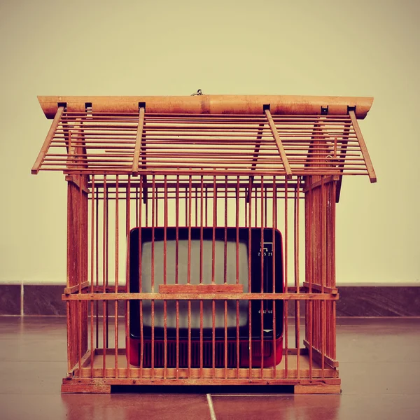 Television in a birdcage — Stock Photo, Image