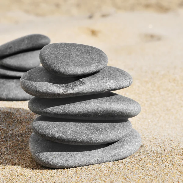 Stacks of stones on the sand of a beach — Stock Photo, Image