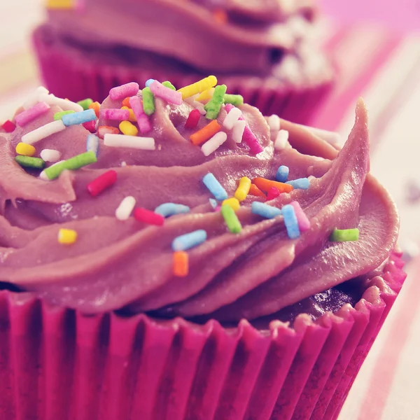 Cupcakes with a retro filter effect — Stock Photo, Image
