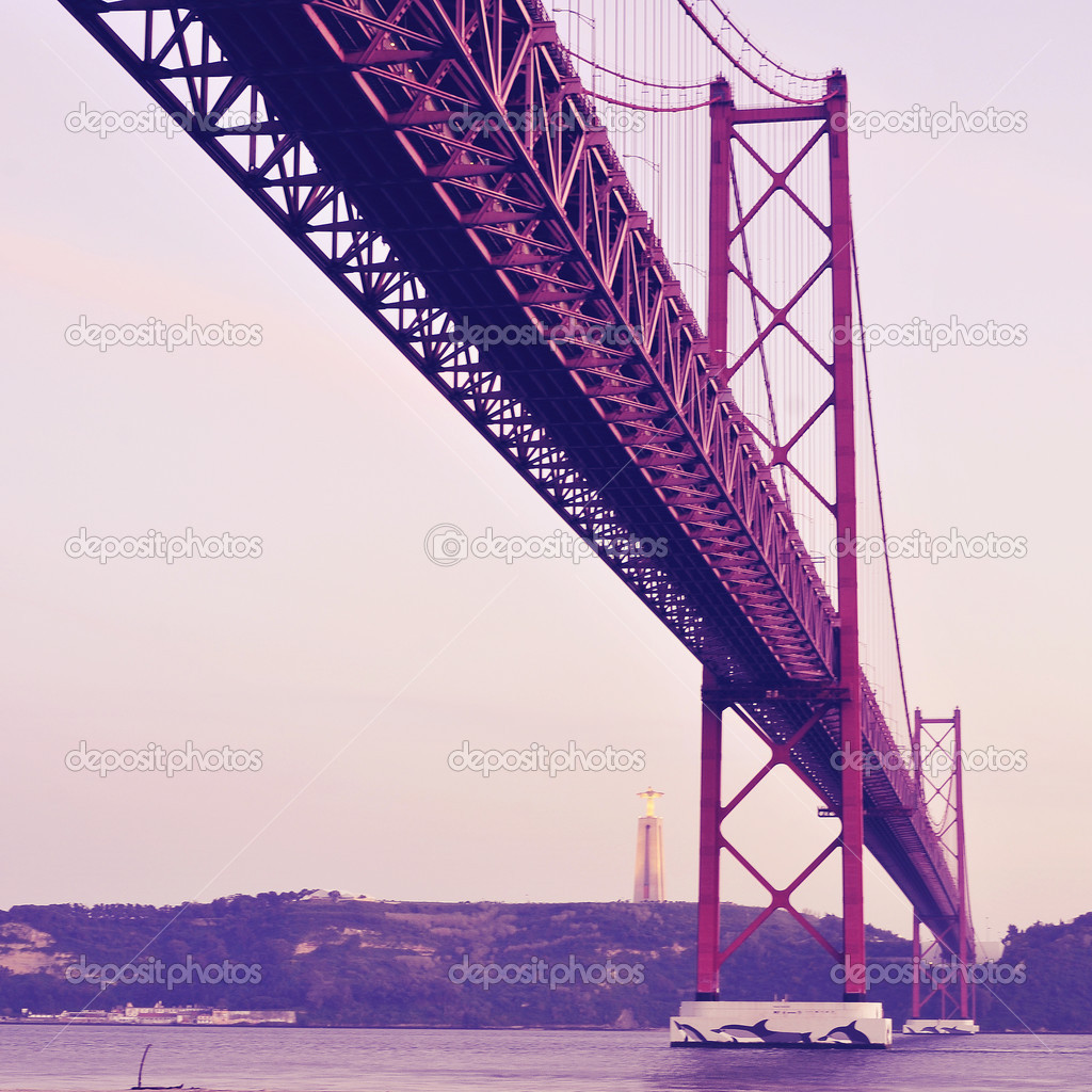 25 de Abril Bridge in Lisbon, Portugal, with a retro filter effe