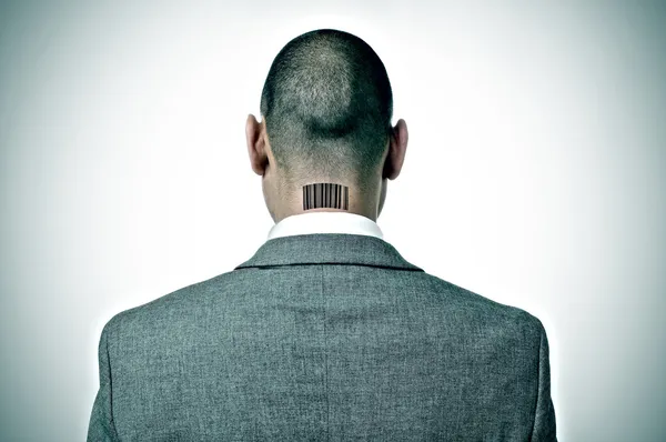 Businessman with a barcode in his nape — Stock Photo, Image