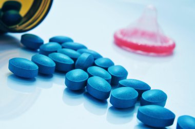 blue pills and condom clipart