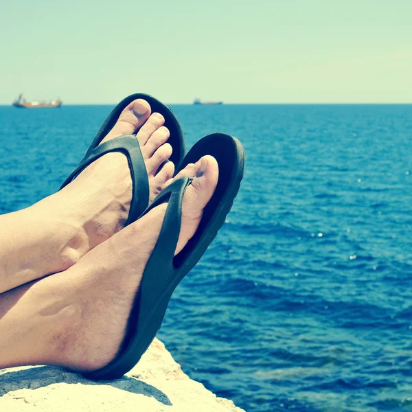 Relaxing near the ocean, with a retro filter effect — Stock Photo, Image
