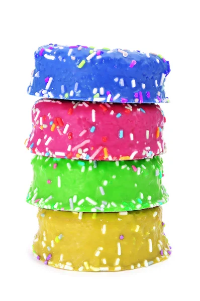 Donuts coated with frosting and sprinkles of different colors — Stock Photo, Image