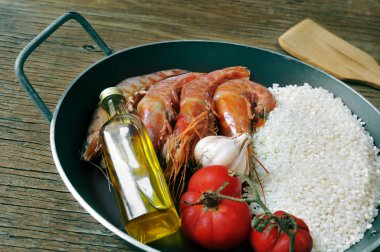 ingredients to prepare a spanish paella or arroz negro clipart