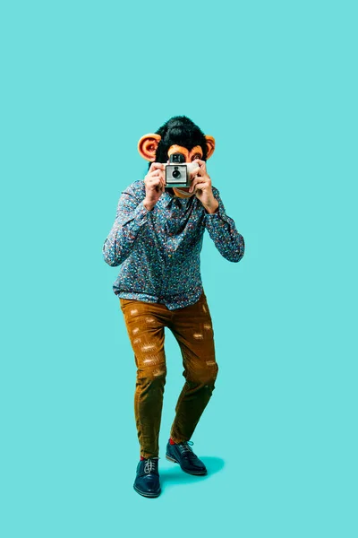 Man Wearing Monkey Mask Taking Picture Retro Instant Camera Standing — Stock Photo, Image