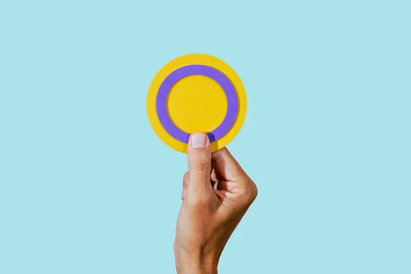 Young Person Holds Circular Intersex Flag Hand Pale Green Background — Stock Photo, Image