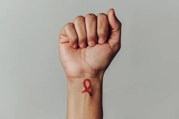 Raised Fist Man Red Awareness Ribbon Fight Aids Painted His — Stock Photo, Image