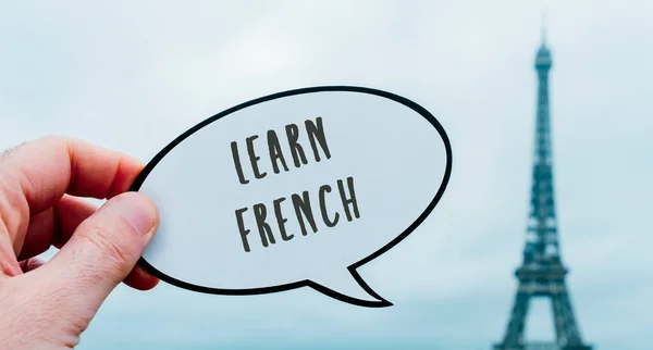 Man Holds Speech Balloon Reads Text Learn French Front Eiffel — Stock Photo, Image