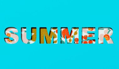 the word summer cut out on a blue paper, and a floral background seen through the cutout letters
