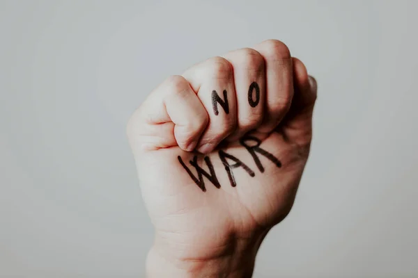 Closeup Clenched Fist Man Text War Written White Background — Stock Photo, Image