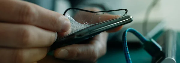 Closeup Man Sitting Table Worktop Who Removing Broken Screen Protector — Stock Photo, Image