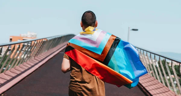 Closeup Man Street Seen Wrapped Progress Pride Flag Walking Bridge — Stock fotografie