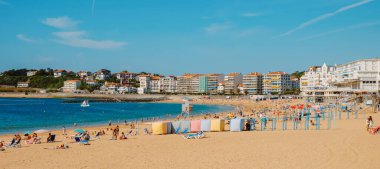 Saint-Jean-de-Luz, France - June 24, 2022: Panoramic view of La Grande Plage beach in Saint-Jean-de-Luz, France, with many people enjoying the good weather in a summer day