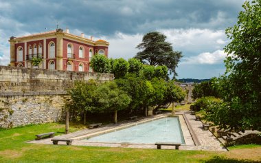 a view of a pond and a garden at the ramparts of the fortified old town of Hondarribia, in the Basque Country, Spain