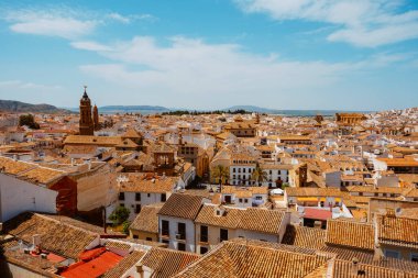 an aerial view over the rooftops of the old town of Antequera, in the province of Malaga, Spain, in a sunny spring day
