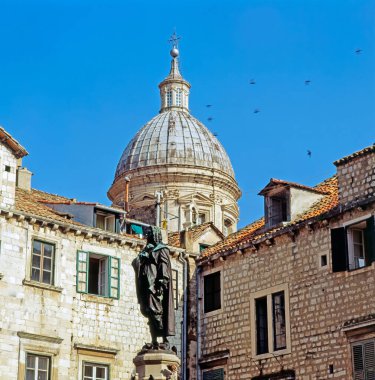 The Cathedral of the Assumption of the Virgin Mary with Ivan Gundulic statue in Gundulic Squarein Dubrovnik, Croatia, build in 1673-1713