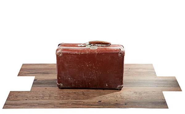 Starý kufr na dřevěnou podlahu — Stock fotografie