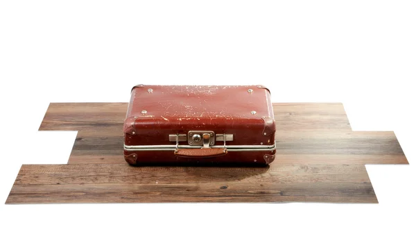 Old suitcase on wooden floor — Stock Photo, Image