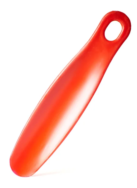 Red shoehorn on white background — Stock Photo, Image