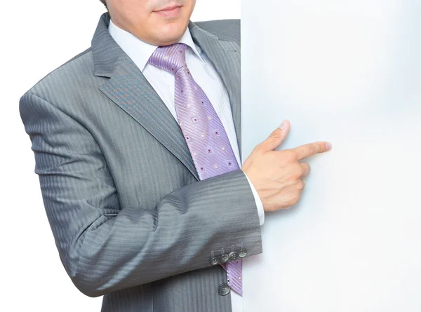 Hombre apuntando a tablero en blanco — Foto de Stock