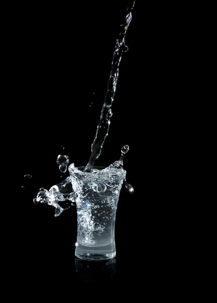 Vodka glass with splashes — Stock Photo, Image