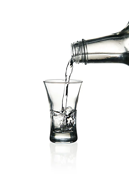 Vodka glass with splashes — Stock Photo, Image