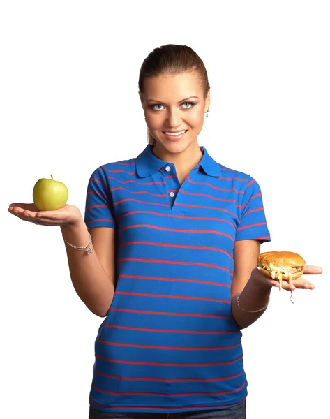 Woman with hamburger and apple — Stock Photo, Image