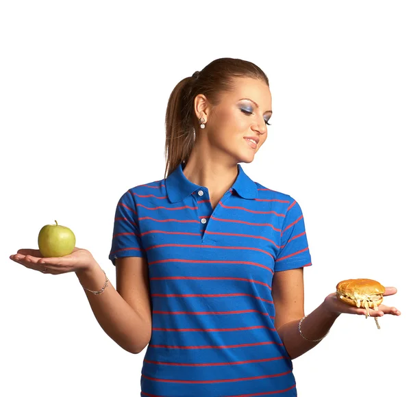 Woman with hamburger and apple — Stock Photo, Image