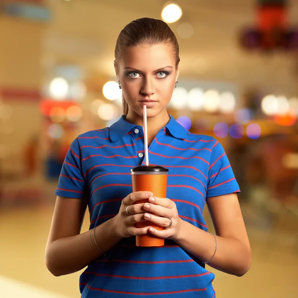 Young woman with a paper cup — Stock Photo, Image