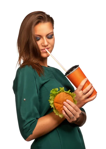 Beautiful girl holding hamburger and cola — Stock Photo, Image