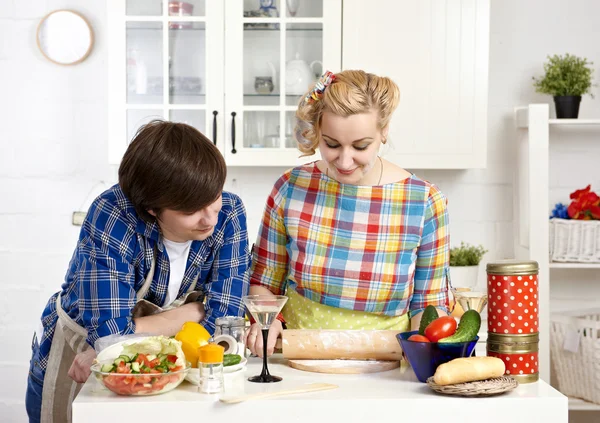 Couple preparing meat dumplings