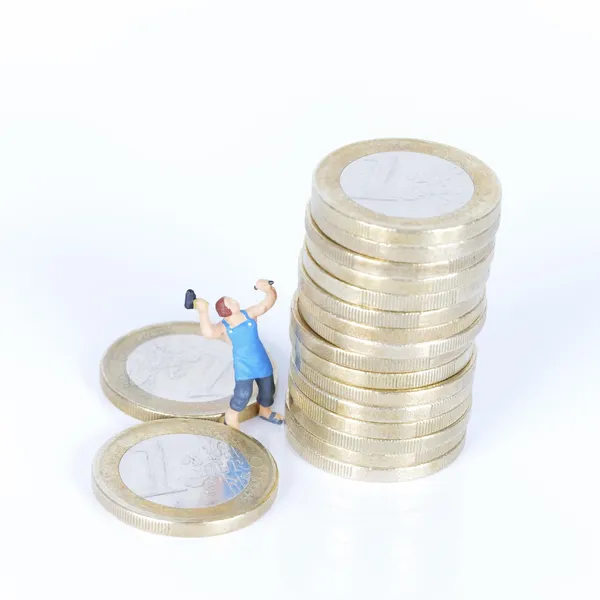 Monedas en euros con escultor —  Fotos de Stock