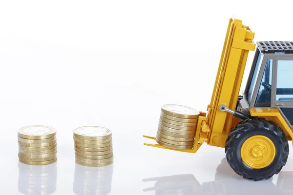Euro money coins and forklift Stock Image