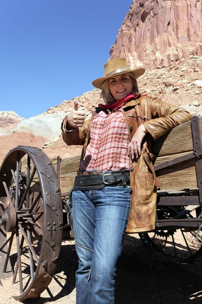 Happy woman wearing a cowboy hat — Stock Photo, Image