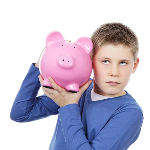 Boy with big pink piggy bank Stock Photo