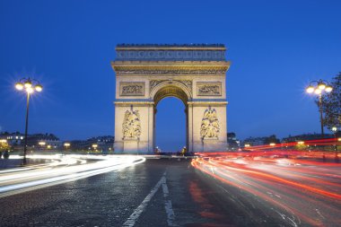 The famous Arc de Triomphe by night clipart