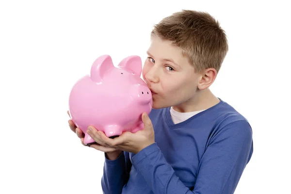 Menino beijar rosa piggybank — Fotografia de Stock